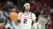 Jan 11, 2025; Fayetteville, Arkansas, USA; Arkansas Razorbacks guard Boogie Fland (2) dribbles during the first half against the Florida Gators at Bud Walton Arena. Mandatory Credit: Nelson Chenault-Imagn Images