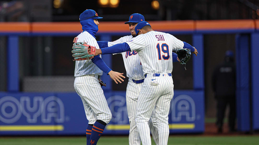 Apr 8, 2025; New York City, New York, USA; New York Mets left fielder Brandon Nimmo (9) and right fielder Tyrone Taylor (15) and center fielder Jose Siri (19) celebrates after defeating the Miami Marlins at Citi Field. 