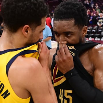 May 13, 2025; Cleveland, Ohio, USA; Indiana Pacers guard Tyrese Haliburton (0) talks to Cleveland Cavaliers guard Donovan Mitchell (45) after game five of the second round for the 2025 NBA Playoffs at Rocket Arena. Mandatory Credit: Ken Blaze-Imagn Images