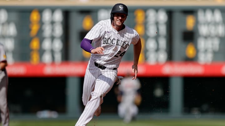 Colorado Rockies third baseman Ryan McMahon (24) runs towards third as he scores on an RBI in the eighth inning against the Atlanta Braves at Coors Field on Aug 11.