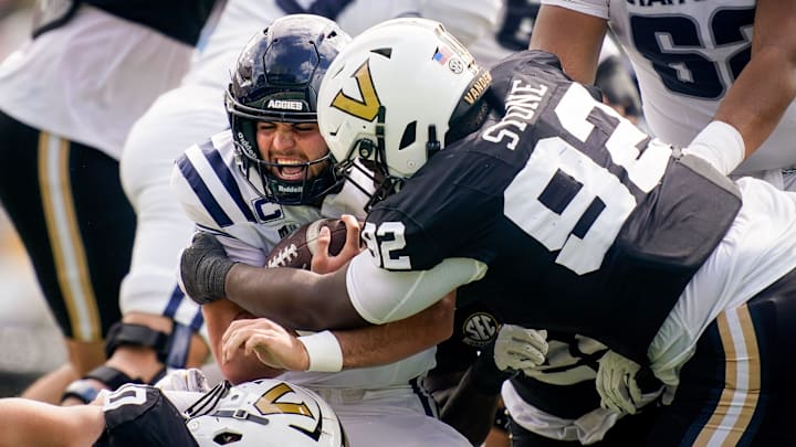 Vanderbilt defensive lineman Jaylon Stone (92) tackles Utah State quarterback Bryson Barnes (16) during the second quarter at FirstBank Stadium in Nashville, Tenn., Saturday, Sept. 27, 2025. Vanderbilt defensive lineman Jaylon Stone (92) tackles Utah State quarterback Bryson Barnes (16) during the second quarter at FirstBank Stadium in Nashville, Tenn., Saturday, Sept. 27, 2025.