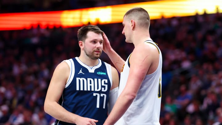 Mar 17, 2024; Dallas, Texas, USA;  Dallas Mavericks guard Luka Doncic (77) speaks with Denver Nuggets center Nikola Jokic (15) during the second half at American Airlines Center. 