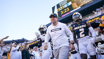 Sep 7, 2024; Columbia, Missouri, USA; Missouri Tigers head coach Eli Drinkwitz runs out with the team against the Buffalo Bulls prior to a game at Faurot Field at Memorial Stadium. Mandatory Credit: Denny Medley-Imagn Images
