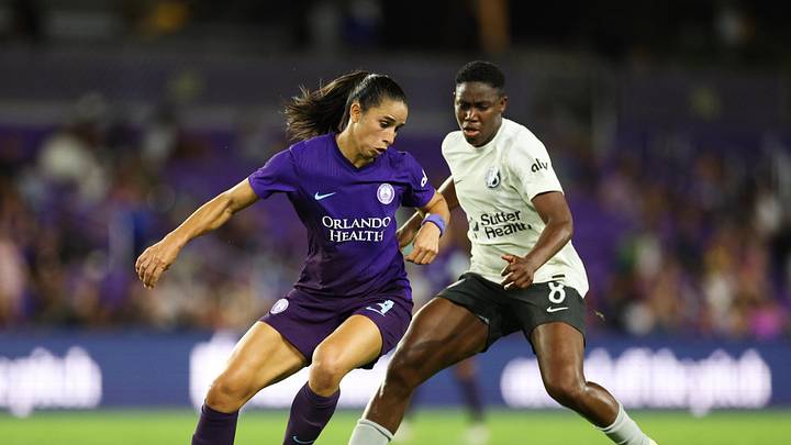 Orlando Pride defender Rafaelle (4) battles for the ball against Bay FC forward Asisat Oshoala (8) during the second half at Inter&Co Stadium