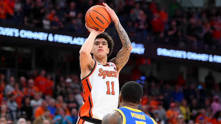 Mar 7, 2026; Syracuse, New York, USA; Syracuse Orange guard Naithan George (11) shoots against Pittsburgh Panthers guard Damarco Minor (7) during the second half at the JMA Wireless Dome. Mandatory Credit: Rich Barnes-Imagn Images