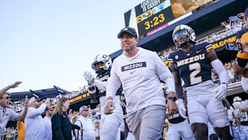 Missouri Tigers head coach Eli Drinkwitz runs out with the team before a game agaisnt the Buffalo Bulls last season.