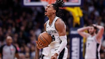 Nov 28, 2025; Denver, Colorado, USA; San Antonio Spurs guard Devin Vassell (24) reacts after a play in the fourth quarter against the Denver Nuggets at Ball Arena. Mandatory Credit: Isaiah J. Downing-Imagn Images