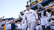 Sep 7, 2024; Columbia, Missouri, USA; Missouri Tigers head coach Eli Drinkwitz runs out with the team against the Buffalo Bulls prior to a game at Faurot Field at Memorial Stadium.