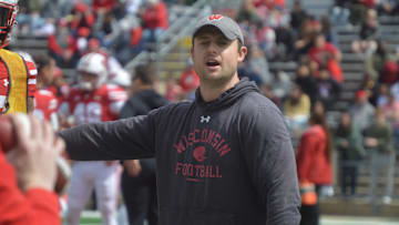 Wisconsin safeties coach Jack Cooper runs Badgers through position drills during the program's April 19 spring showcase scrimmage.