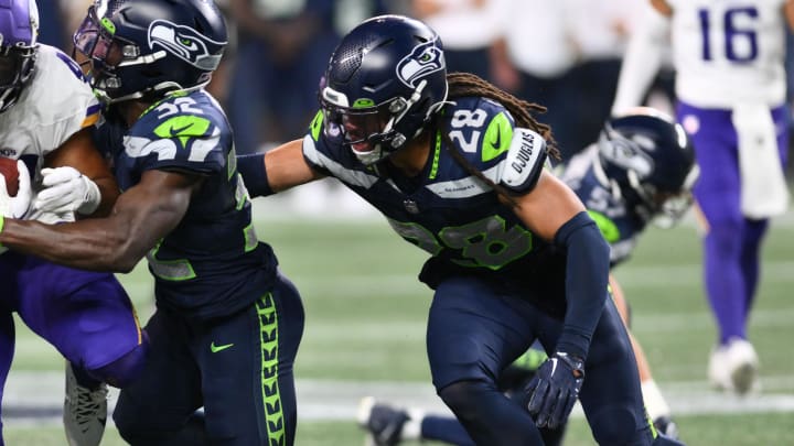 Aug 10, 2023; Seattle, Washington, USA; Minnesota Vikings running back Abram Smith (41) carries the ball while Seattle Seahawks safety Jonathan Sutherland tries to tackle during the second half at Lumen Field.