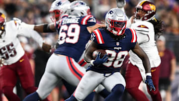 Aug 8, 2025; Foxborough, Massachusetts, USA; New England Patriots running back Rhamondre Stevenson (38) runs against the Washington Commanders during the first half at Gillette Stadium. Mandatory Credit: Brian Fluharty-Imagn Images