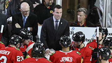 Oct 19, 2024; Chicago, Illinois, USA;  Chicago Blackhawks head coach Luke Richardson talks with the team during the third period against the Buffalo Sabres at the United Center. Mandatory Credit: Matt Marton-Imagn Images