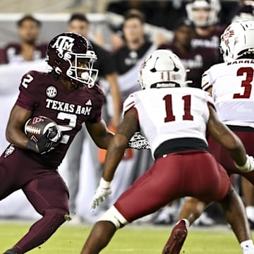 Nov 16, 2024; College Station, Texas, USA; Texas A&M Aggies wide receiver Terry Bussey (2) runs the ball during the fourth quarter against the New Mexico State Aggies at Kyle Field. Mandatory Credit: Maria Lysaker-Imagn Images 