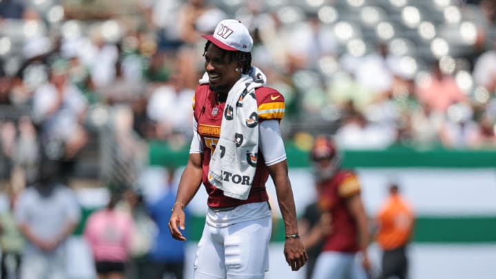 Aug 10, 2024; East Rutherford, New Jersey, USA; Washington Commanders quarterback Jayden Daniels (5) looks on during the first half against the New York Jets at MetLife Stadium. Mandatory Credit: Vincent Carchietta-USA TODAY Sports