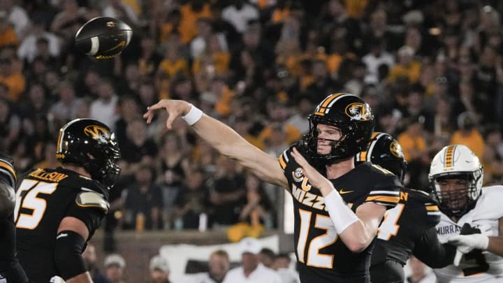 Aug 29, 2024; Columbia, Missouri, USA; Missouri Tigers quarterback Brady Cook (12) throws a pass against the Murray State Racers during the first half at Faurot Field at Memorial Stadium. Mandatory Credit: Denny Medley-USA TODAY Sports