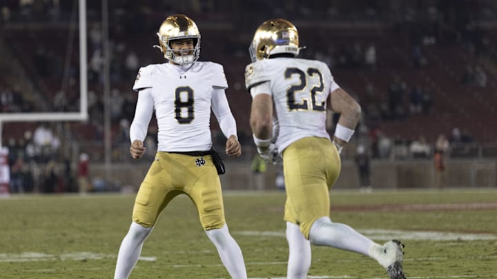 Nov 29, 2025; Stanford, California, USA;  Notre Dame Fighting Irish running back Aneyas Williams (22) celebrates with Notre Dame Fighting Irish quarterback Kenny Minchey (8) after scoring a touchdown during the fourth quarter against the Stanford Cardinal at Stanford Stadium. Mandatory Credit: Stan Szeto-Imagn Images