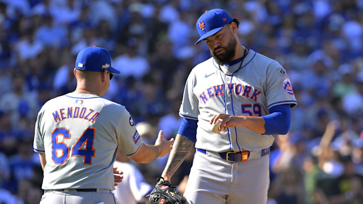 Oct 14, 2024; Los Angeles, California, USA; New York Mets manager Carlos Mendoza (64) relieves pitcher Sean Manaea (59) in the sixth inning against the Los Angeles Dodgers during game two of the NLCS for the 2024 MLB Playoffs at Dodger Stadium. Mandatory Credit: Jayne Kamin-Oncea-Imagn Images