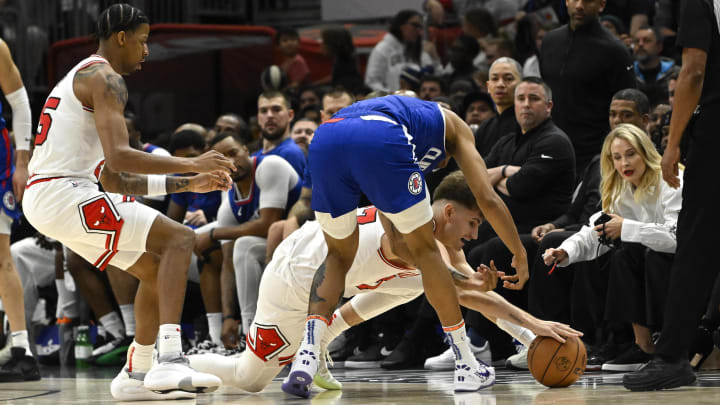 Mar 14, 2024; Chicago, Illinois, USA;  Chicago Bulls forward Henri Drell (77) chases a loose ball against the LA Clippers during the second half at the United Center. 