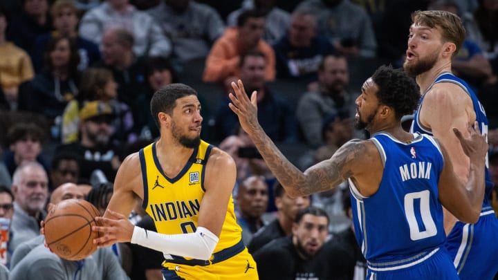 Feb 2, 2024; Indianapolis, Indiana, USA; Indiana Pacers guard Tyrese Haliburton (0) passes the ball while Sacramento Kings guard Malik Monk (0) defends in the second half at Gainbridge Fieldhouse. Mandatory Credit: Trevor Ruszkowski-USA TODAY Sports