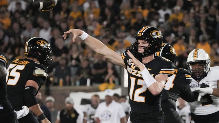 Aug 29, 2024; Columbia, Missouri, USA; Missouri Tigers quarterback Brady Cook (12) throws a pass against the Murray State Racers during the first half at Faurot Field at Memorial Stadium. Mandatory Credit: Denny Medley-USA TODAY Sports