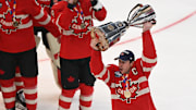 Feb 20, 2025; Boston, MA, USA; [Imagn Images direct customers only]  Team Canada forward Sidney Crosby (87) lifts the 4 Nations Face-Off trophy after winning against Team USA in overtime  during the 4 Nations Face-Off ice hockey championship game at TD Garden. Mandatory Credit: Brian Fluharty-Imagn Images