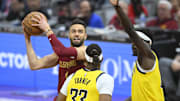 Apr 12, 2024; Cleveland, Ohio, USA; Cleveland Cavaliers guard Max Strus (1) looks to the basket beside Indiana Pacers center Myles Turner (33) in the first quarter at Rocket Mortgage FieldHouse. Mandatory Credit: David Richard-Imagn Images