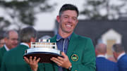 Rory McIlroy holds the Masters championship trophy.