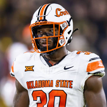 Sep 9, 2023; Tempe, Arizona, USA; Oklahoma State Cowboys linebacker Collin Oliver (30) against the Arizona State Sun Devils at Mountain America Stadium. Mandatory Credit: Mark J. Rebilas-Imagn Images