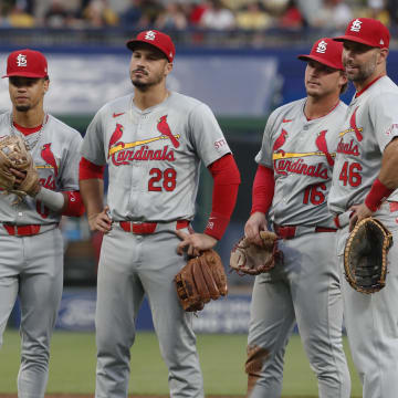 Jul 2, 2024; Pittsburgh, Pennsylvania, USA;  St. Louis Cardinals shortstop Masyn Winn (left) and third baseman Nolan Arenado (28) and second baseman Nolan Gorman (16) and first baseman Paul Goldschmidt (46) look on during a Cardinals pitching change against the Pittsburgh Pirates during the sixth inning at PNC Park. Mandatory Credit: Charles LeClaire-USA TODAY Sports