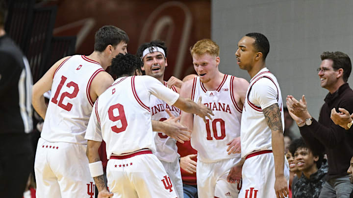 Jan 8, 2025; Bloomington, Indiana, USA; The Indiana Hoosiers celebrate after a play during the second half against the USC Trojans at Simon Skjodt Assembly Hall. Mandatory Credit: Robert Goddin-Imagn Images