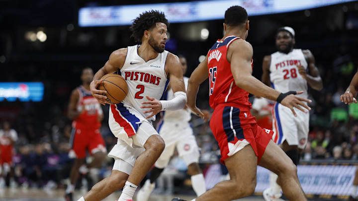 Nov 17, 2024; Washington, District of Columbia, USA; Detroit Pistons guard Cade Cunningham (2) drives to the basket as Washington Wizards guard Malcolm Brogdon (15) defend in the first half at Capital One Arena. Mandatory Credit: Geoff Burke-Imagn Images