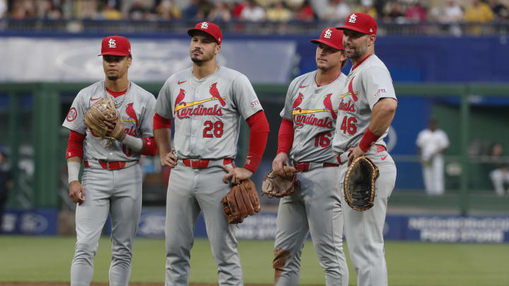 Jul 2, 2024; Pittsburgh, Pennsylvania, USA;  St. Louis Cardinals shortstop Masyn Winn (left) and third baseman Nolan Arenado (28) and second baseman Nolan Gorman (16) and first baseman Paul Goldschmidt (46) look on during a Cardinals pitching change against the Pittsburgh Pirates during the sixth inning at PNC Park. Mandatory Credit: Charles LeClaire-USA TODAY Sports