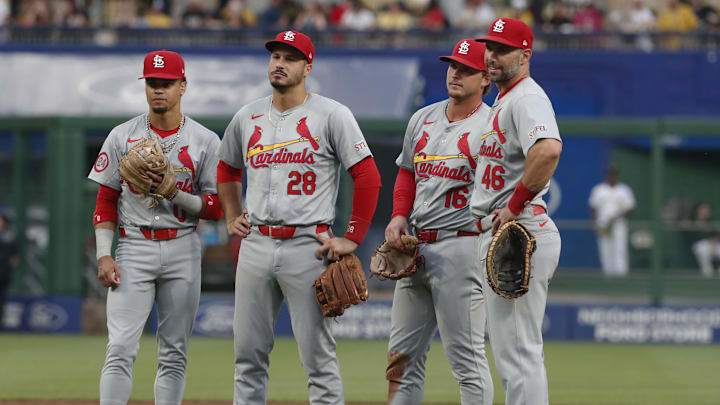 Jul 2, 2024; Pittsburgh, Pennsylvania, USA;  St. Louis Cardinals shortstop Masyn Winn (left) and third baseman Nolan Arenado (28) and second baseman Nolan Gorman (16) and first baseman Paul Goldschmidt (46) look on during a Cardinals pitching change against the Pittsburgh Pirates during the sixth inning at PNC Park. Mandatory Credit: Charles LeClaire-Imagn Images