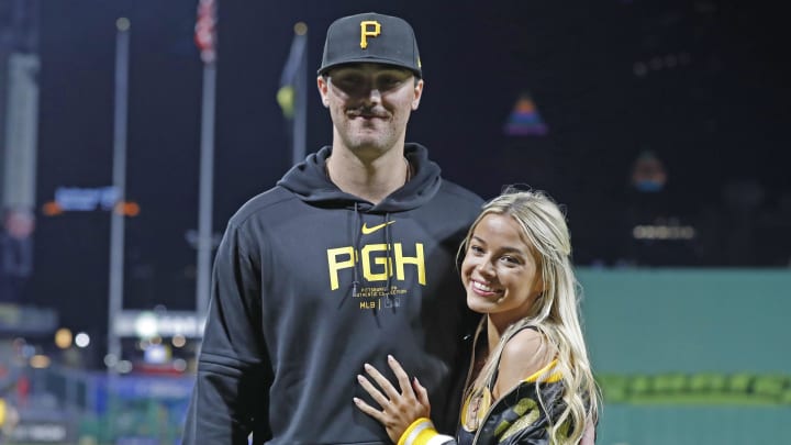 May 11, 2024; Pittsburgh, Pennsylvania, USA;  Pittsburgh Pirates starting pitcher Paul Skenes (30) poses with his girlfriend Louisiana State University gymnast Olivia Dunn (right) after making his major league debut against the Chicago Cubs at PNC Park. The Pirates won 10-8. Mandatory Credit: Charles LeClaire-USA TODAY Sports