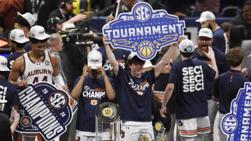 Mar 17, 2024; Nashville, TN, USA; The Auburn Tigers celebrate after defeating the Florida Gators in the SEC Tournament Championship.