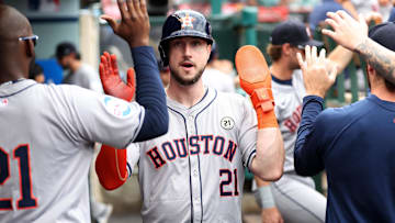 Sep 15, 2024; Anaheim, California, USA;  Houston Astros right fielder Kyle Tucker (21) is greeted in the dugout after scoring a run during the fourth inning against the Los Angeles Angels at Angel Stadium. Mandatory Credit: Kiyoshi Mio-Imagn Images