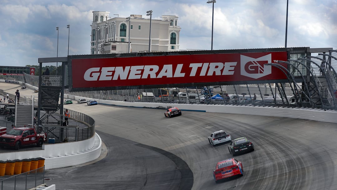 Jul 20, 2025; Dover, Delaware, USA; NASCAR Cup Series cars race through turn two during the Autotrader EchoPark Automotive 400 at Dover Motor Speedway. 