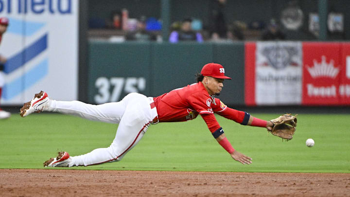 Aug 7, 2024; St. Louis, Missouri, USA;  St. Louis Cardinals shortstop Masyn Winn (0) dives but is unable to field a ground ball against the Tampa Bay Rays during the third inning at Busch Stadium. Mandatory Credit: Jeff Curry-Imagn Images