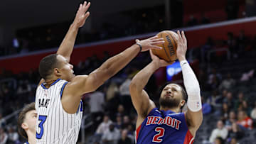 Oct 29, 2025; Detroit, Michigan, USA; Detroit Pistons guard Cade Cunningham (2) shoots on Orlando Magic guard Desmond Bane (3) in the second half at Little Caesars Arena. Mandatory Credit: Rick Osentoski-Imagn Images