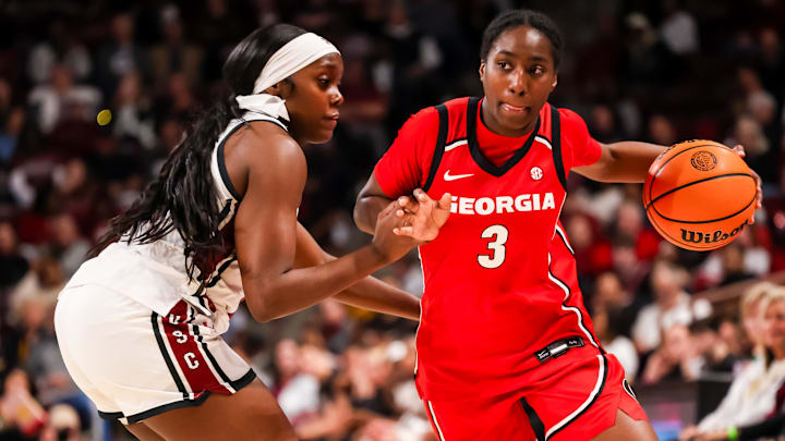 Jan 11, 2026; Columbia, South Carolina, USA; Georgia Bulldogs guard Dani Carnegie (3) drives around South Carolina Gamecocks guard Raven Johnson (25) in the second half at Colonial Life Arena. Mandatory Credit: Jeff Blake-Imagn Images