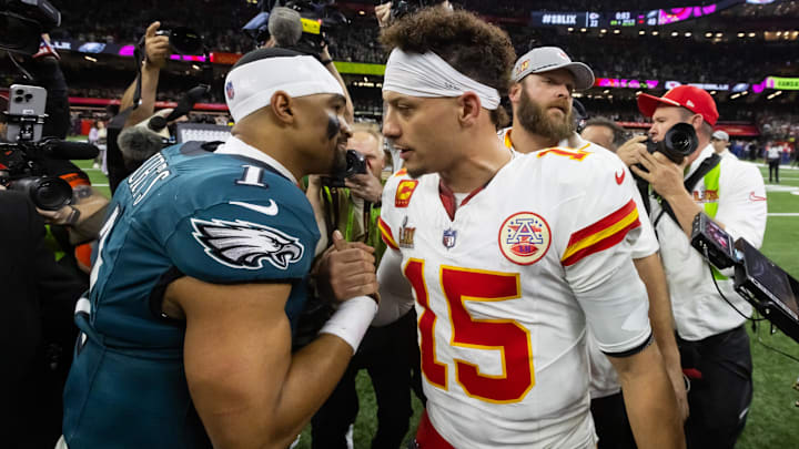 Feb 9, 2025; New Orleans, LA, USA; Philadelphia Eagles quarterback Jalen Hurts (1) greets Kansas City Chiefs quarterback Patrick Mahomes (15) following Super Bowl LIX at Ceasars Superdome. Mandatory Credit: Mark J. Rebilas-Imagn Images