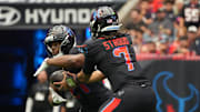 Oct 26, 2025; Houston, Texas, USA; Houston Texans quarterback C.J. Stroud (7) hands a ball off to running back Nick Chubb (21) during the second half against the San Francisco 49ers at NRG Stadium. Mandatory Credit: Sean Thomas-Imagn Images