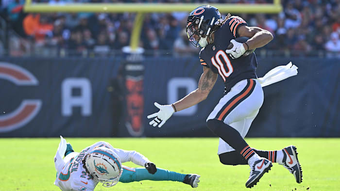 Nov 6, 2022; Chicago, Illinois, USA;  Chicago Bears wide receiver Chase Claypool (10) avoids a