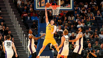 Jul 6, 2024; San Francisco, CA, USA; Los Angeles Lakers center Colin Castleton (14) scores against the Sacramento Kings during the second quarter at Chase Center. Mandatory Credit: Kelley L Cox-USA TODAY Sports