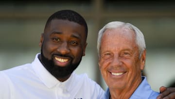 Sep 9, 2017; Chapel Hill, NC, USA; Former UNC Basketball player Raymond Felton and head coach Roy Williams before the game at Kenan Memorial Stadium. Mandatory Credit: Bob Donnan-Imagn Images