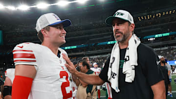 Aug 24, 2024; East Rutherford, New Jersey, USA; New York Jets quarterback Aaron Rodgers (8) talks with New York Giants quarterback Drew Lock (2) after the game at MetLife Stadium. Mandatory Credit: Vincent Carchietta-Imagn Images