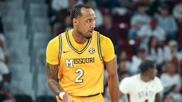 Feb 1, 2025; Starkville, Mississippi, USA; Missouri Tigers guard Tamar Bates (2) reacts after a three point basket against the Mississippi State Bulldogs during the second half at Humphrey Coliseum. Mandatory Credit: Wesley Hale-Imagn Images