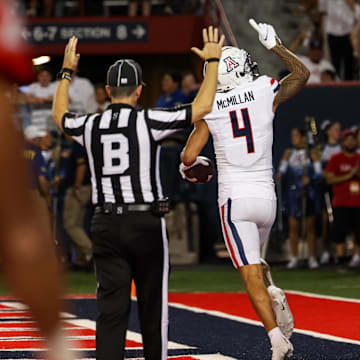 Arizona Wildcats wide receiver Tetairoa McMillan (4) celebrates touchdown catch.