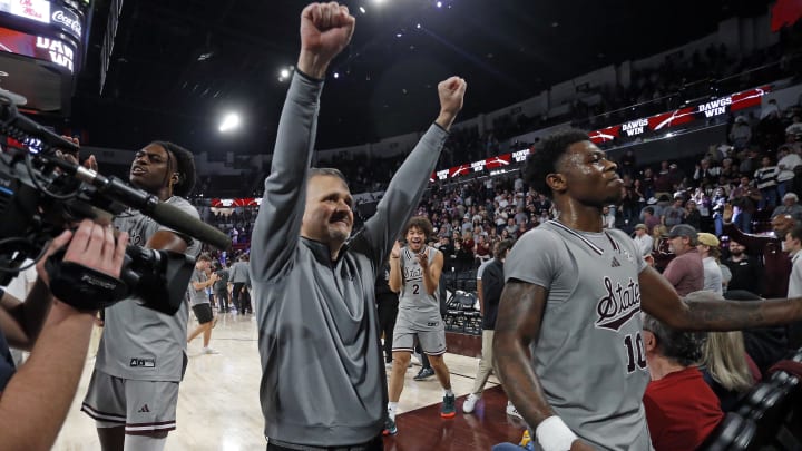 Feb 21, 2024; Starkville, Mississippi, USA; Mississippi State Bulldogs head coach Chris Jans (left) and guard Dashawn Davis (10) react after defeating the Mississippi Rebels at Humphrey Coliseum. Mandatory Credit: Petre Thomas-USA TODAY Sports