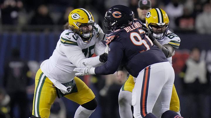 Green Bay Packers guard Sean Rhyan (75) and guard Aaron Banks (65) double team Chicago Bears defensive tackle Andrew Billings (97) during the second quarter of their game Saturday, December 20, 2025 at Soldier Field in Chicago, Illinois.